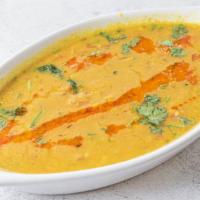 Dal Tadka · Yellow lentils cooked in cumin seeds, mustard and curry leaves.