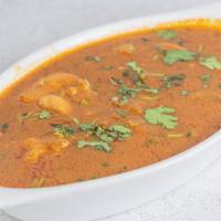 Chicken Curry · Chicken cooked in South Indian spicy gravy.