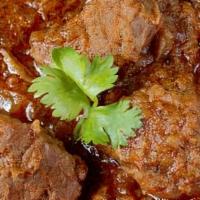 Lamb Curry Boneless · Lamb boneless pieces cooked in South Indian spices.