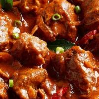 Goat Rogan Josh · Goat with bone cooked in tomato gravy and spices.