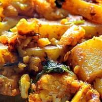 Aloo Gobi · Cauliflower and tomatoes cooked in spices and tomatoes.