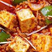 Kadai Paneer · Paneer cooked in spices, green peppers, onions and tomato gravy.