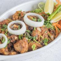 Chicken Sukha  (Chef'S Special) · Dharani special chicken slow roasted in South Indian spices.