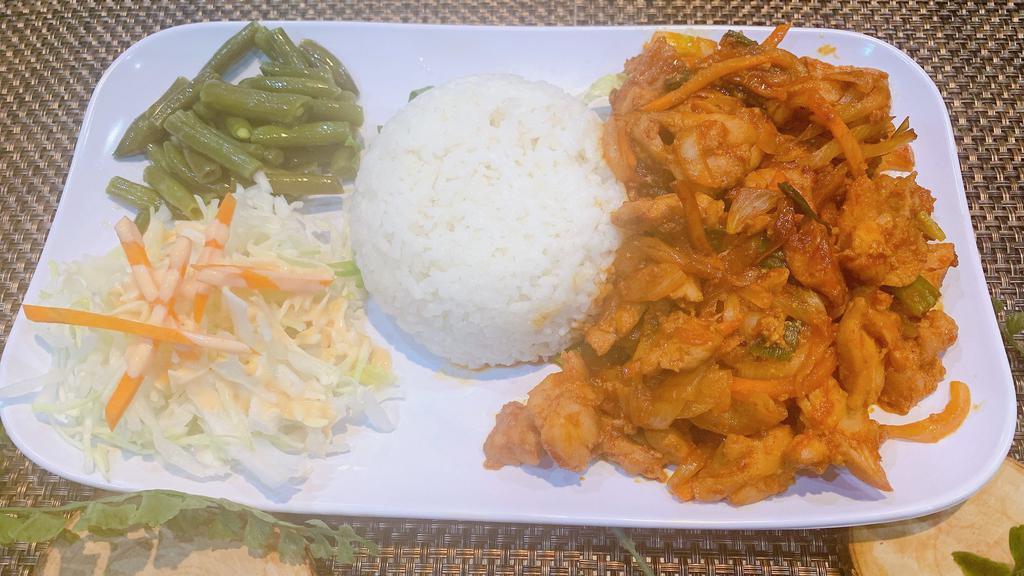 K3 Spicy Chicken With Rice · Boneless chicken marinated in spicy sauce served with veggies and side of rice.