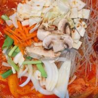 H6 Spicy Braised Chicken Hot Pot · Chicken braised in hot pot of spicy broth and glass noodles with onions, potatoes, carrots, ...