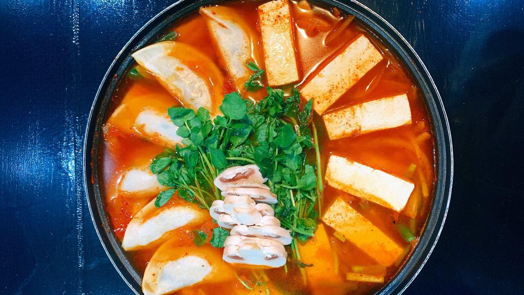 H5 Kimchi & Dumplin Hot Pot · Hot pot of spicy broth with kimchi, dumplings, and vegetables. Serving for 2.
