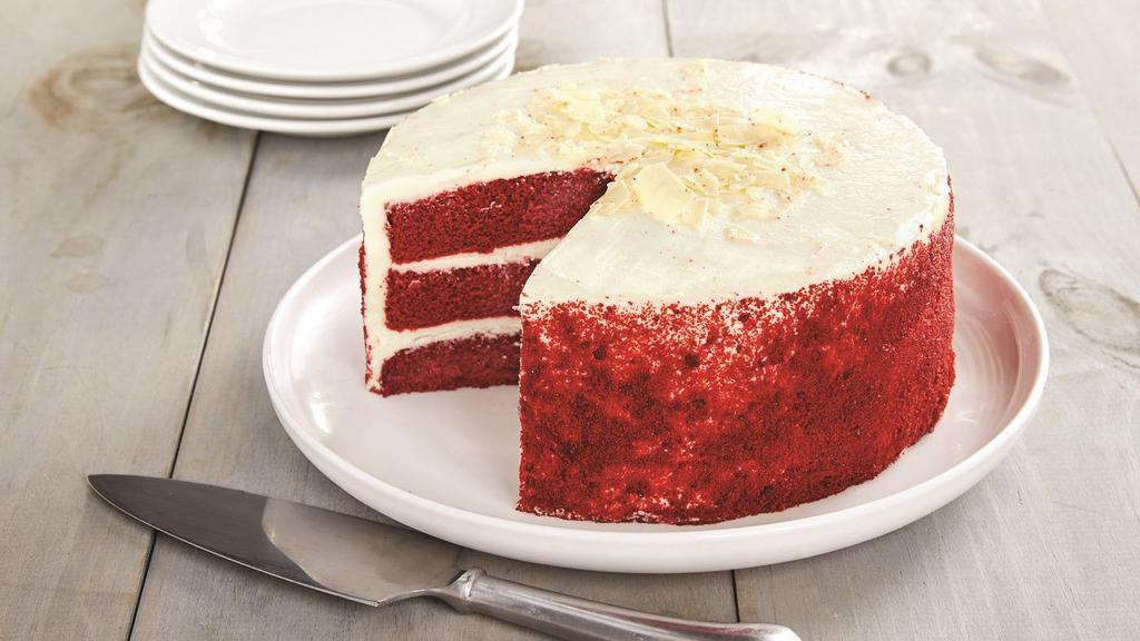 Red Velvet Cake · Our HoneyBaked Red Velvet Cake is topped with rich shavings of white chocolate for a touch of elegance and sophistication. Each slice features three layers of cake gently separated by two layers of decadent cream cheese icing. Few dessert offerings are as classically delicious as Red Velvet Cake. Whether you are making plans to entertain a large group of people at a formal event or host an intimate holiday dinner, our limited time only Red Velvet dessert will make the occasion unforgettable. Made with alternating layers of moist cake and velvety cream cheese icing, each bite is absolutely heavenly.