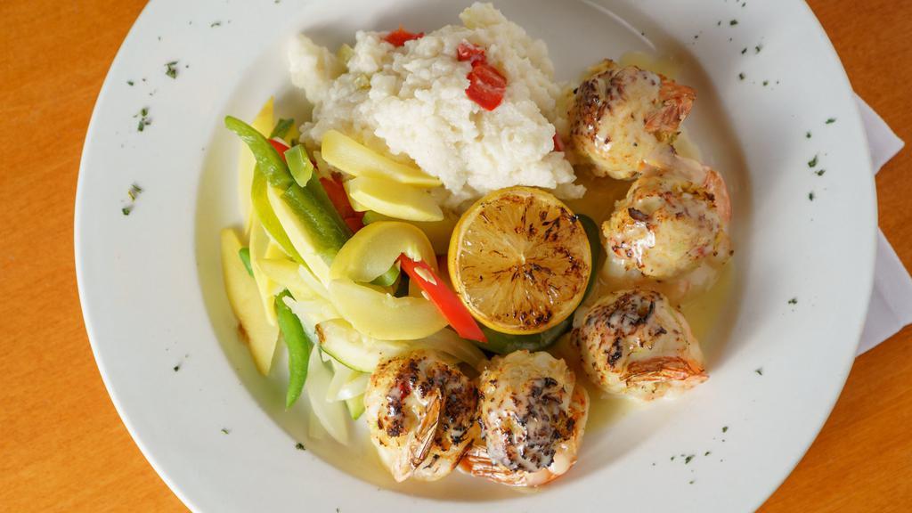 Baked Stuffed Shrimp · Baked jumbo shrimp stuffed with crab meat, served with spinach risotto and mixed vegetables, drizzled with lemon butter sauce