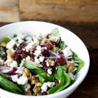 Spinach Gorgonzola Salad · Baby spinach topped with mushrooms, red onions, walnuts, dried cranberries and gorgonzola.