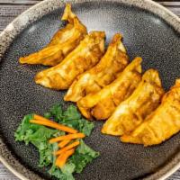 Gyoza · 6 pieces. Deep fried pork vegetable dumpling.