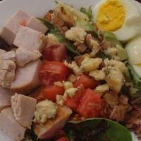 Roast Turkey Cobb Salad · Roast turkey breast, mixed greens, tomatoes, crispy bacon, hard boiled eggs, avocado, avocad...