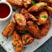 Sweet Chilli Traditional Wings · Delicious crispy whole chicken wings deep-fried tossed with sweet chili sauce.