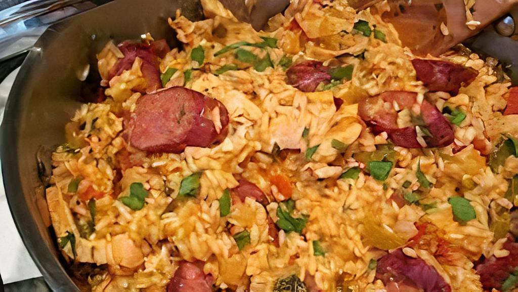 Jambalaya (Chicken & Beef Sausage) (16 Oz) · Item may be served hot or cold......a flavorful blend of onions bell pepper and celery slow cooked with tomatoes beef sausage and chicken and tossed with rice....delicious