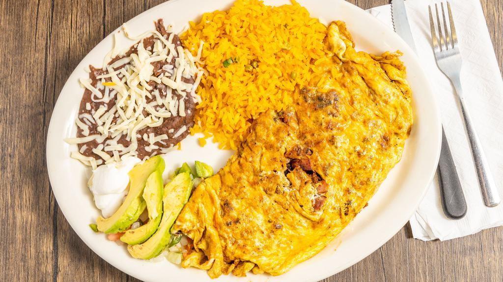 Omelet · Three eggs with ham, Mexican sausage, pico de
gallo and Mexican cheese served with black refried
beans on the side.