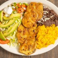 Milanesa · Thinly sliced and breaded with black
refried beans, rice, lettuce, tomatoes, pico
de gallo, ...