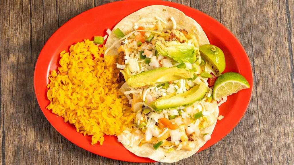 2 Fish Tacos · Soft flour or corn tortillas filled with fried tilapia topped with pico de gallo, lettuce, Mexican cheese, avocado and special chipotle sauce served with rice on the side.