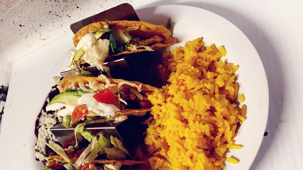 Tacos Dorados · Three crispy shell tacos filled with your choice
of shredded chicken, grilled chicken, ground
beef or steak topped with lettuce, tomatoes,
sour cream, Mexican cheese, cilantro and
avocado.
