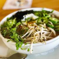 Tonkotsu Ramen Bowl · Pork & Chicken Broth, Mushrooms, sweet corn, nori, slow-cooked egg, scallions, sprouts, jala...