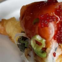 Alaska Roll · Spicy. Spicy tuna, tempura shrimp, crab stick, avocado, jalapeños, and fresh salmon.