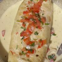 Burrito Grande · A 12 inch flour tortilla filled with your choice of beef or chicken. Stuffed with rice and b...