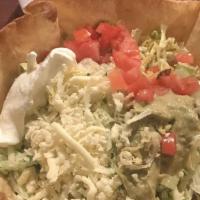 Lunch Taco Salad · A crisp, flour tortilla filled with ground beef or chicken and refried beans, lettuce, tomat...