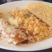 Lunch Enchilada Supreme · One chicken and one beef enchilada topped with lettuce, cheese, sour cream and tomatoes. Ser...