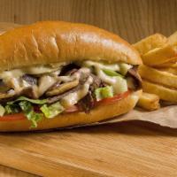 The Mushroom Cheesesteak Sandwich · Delicious Philly steak sandwich loaded with grilled steak, melted cheese and savory mushroom...