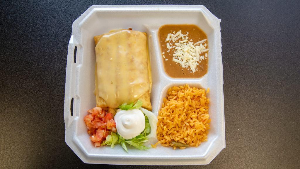 Chimichanga · Flour tortilla deep-fried with your choice of shredded beef, shredded chicken or ground beef filled with shredded cheese.