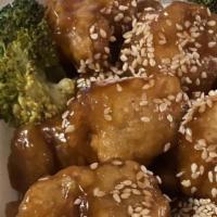 Sesame Chicken · Chunks of chicken sautéed in sweet sauce, with sesame toppings, served with broccoli on the ...