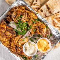 Whole Chicken Mashoob · A mediterranean first in the raleigh area our whole chickens are half deboned marinated gril...