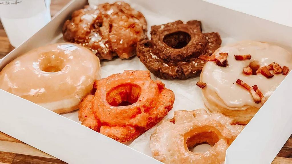 Assorted Half Dozen Doughnuts · A half dozen will consist of yeast, cake, and up to two specialty doughnuts, specialties are any filled doughnuts, cinnamon rolls, and fritters.