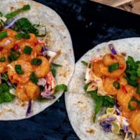 Shrimp Madness Taco · Lightly dusted Shrimp tossed in a Hot, Sweet Chile Sauce with Lettuce, Cabbage and Green Oni...