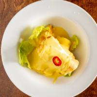 Yummy Yuca Huancaina · Crispy cassava covered in a creamy yellow inca pepper sauce.