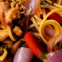 Tallarin Saltado Pollo · Peruvian style fettuccine sautéed with chicken tomatoes, bell peppers, onions, scallions and...