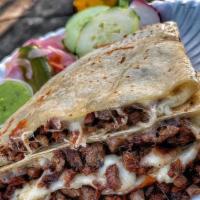 Quesadilla · Flour tortilla filled with cheese and your choice of protein. Includes queso fresco, cream (...
