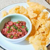 Tuna Crisps · tuna bites, tataki sauce, sesame seeds, green onion, side of fried wonton chips