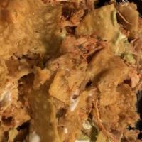 Nachos Tapatios · Chicken or steak with refried beans and cheese.