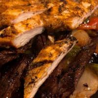 Mixed Fajitas · Steak, chicken, and shrimp served with rice, refried beans, lettuce, onion, tomato, guacamol...