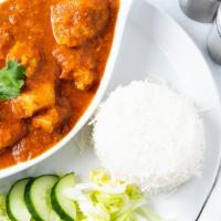 Chicken Curry · A traditional style chicken curry with onion, tomato, spices and ginger garlic.