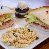 New York Club - Combo · Ham, turkey, bacon, lettuce, tomato, and mayo on three slices of your choice of toasted brea...