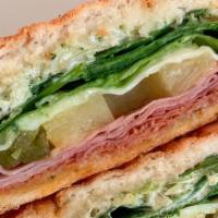 The Outsider · Ham, pepperoni, grilled pineapple, mozzarella cheese, jalapeños, spinach, cilantro mayo, and...