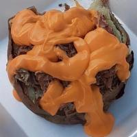 Pappaws Baked Potato · “baked potato with pulled pork or chicken nacho cheese and bbq”.