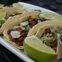Street Tacos · Four small soft corn tortillas with choice of filling (all four must be the same), topped wi...