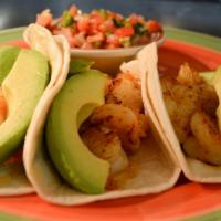 Tacos Veracruz · Three soft flour tortillas stuffed with grilled shrimp and sliced avocado. Served with a sid...