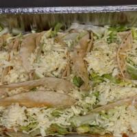 12 Tacos Family Meal · Twelve crispy or soft tacos.  Choice of ground beef or chicken with lettuce and cheese on to...