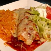 Burrito Special · One beef burrito topped with lettuce, sour cream, and tomatoes. Served with a side of rice.