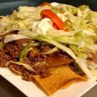 Nachos Supreme · Cheese nachos topped with assorted toppings of ground beef, chopped chicken and fried beans....