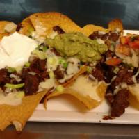  Tex Mex Nachos · Toasted chips topped with melted cheese, chipotle steak or chipotle chicken,  pico de gallo,...