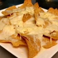 Nachos With Cheese · Toasted chips topped with melted cheese.