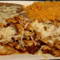 Chori Pollo · Grilled chicken strips topped with chorizo and cheese dip. Served with Spanish rice, fried b...